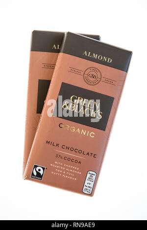Two bars of Green & Black's organic, Fairtrade or Fair Trade ethical almond milk chocolate isolated on white background. Stock Photo
