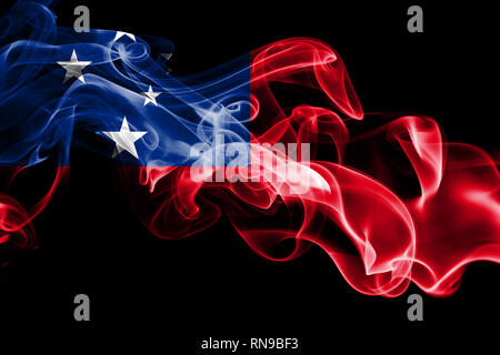 National flag of Samoa made from colored smoke isolated on black background. Abstract silky wave background Stock Photo