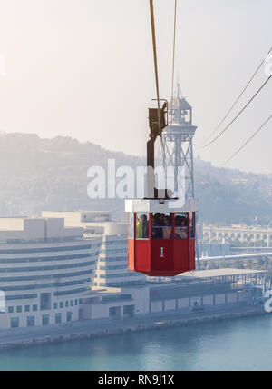 7 February 2019 - Barcelona, Spain. Picture of people using old red port cable car, one of the top attractions. Stock Photo