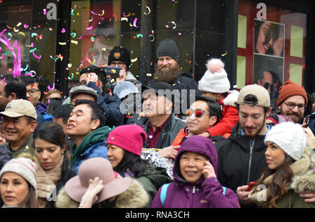 New York City, USA. 17th Feb, 2019. People seen looking at the parade during the Chinese New Year Parade in Chinatown.Chinese communities around the world celebrated the Chinese New Year 2019, the year of the pig. Credit: Ryan Rahman/SOPA Images/ZUMA Wire/Alamy Live News Stock Photo