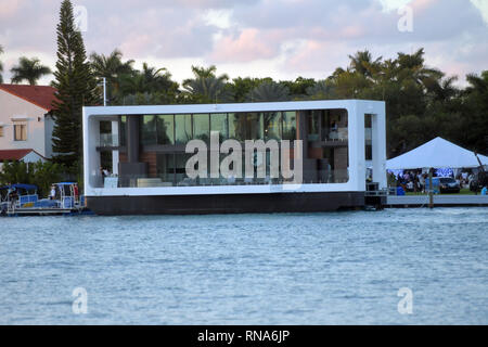 MIAMI BEACH, FL - FEBRUARY 17: Miami-based Arkup LLC is at the Miami Yacht Show from Feb. 15 to 18 displaying this $5.9 million, solar-powered, hurricane-resistant floating home. The off-grid 'livable yacht' can be piloted along coastlines or put down its hydraulic pilings to be as stable as a home on land, on February 17, 2019 in Miami Beach, Florida.    People:  Yacht House Stock Photo