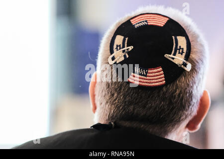 Jerusalem, Israel. 18th February, 2019. A Jewish man wears a knitted yarmulke with the flags of Israel and the United States of America. Credit: Nir Alon/Alamy Live News Stock Photo