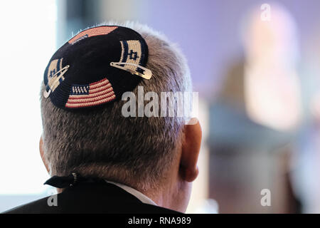 Jerusalem, Israel. 18th February, 2019. A Jewish man wears a knitted yarmulke with the flags of Israel and the United States of America. Credit: Nir Alon/Alamy Live News Stock Photo