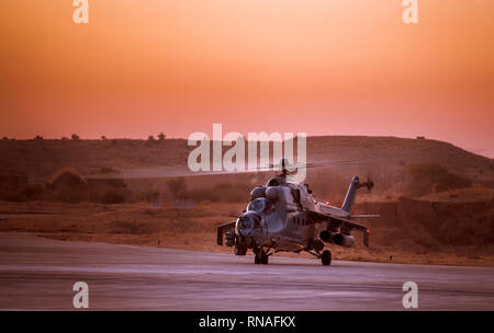 Indian Air Force Mi-35 attack helicopter getting ready to depart from an air force base Stock Photo