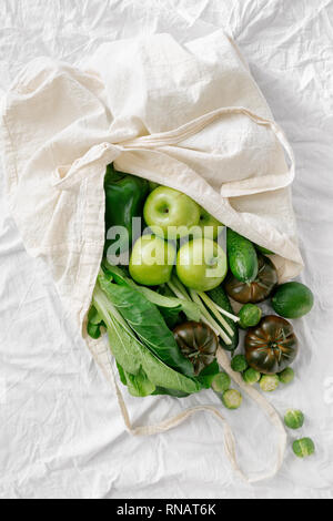 Top view Fresh Organic Food Coming Out From Cloth Eco Shopping Bag, Flat Lay Stock Photo