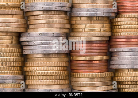 Stacks of shiny euro coins. Money background in silver, gold and copper colors Stock Photo