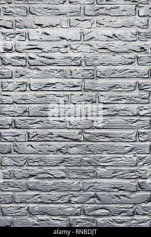 part of silver gray coloured brick wall Stock Photo