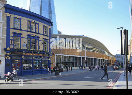 Northern entrance to the newly rebuilt London Bridge railway station on Tooley Street. Shows Shipwrights Arms pub left, the Shard behind. Stock Photo