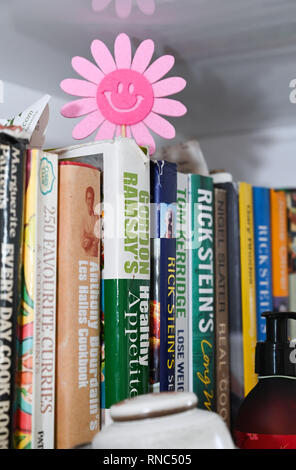 Celebrity chef cookery books on kitchen shelf Stock Photo