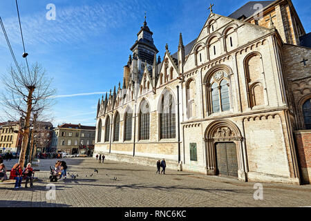 BRUSSELS, BELGIUM - FEBRUARY 17, 2019: Church Notre-Dame de la Chapelle near the market from the place du jeu de balle on a sunny sunday . People walk Stock Photo