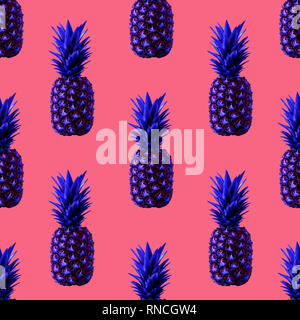 Isolated pineapples Minimal style Seamless pattern with bright blue pineapples on a trendy coral background Stock Photo
