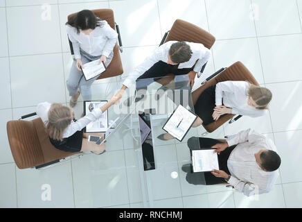 view from the top.the handshake business partners at the meeting. Stock Photo