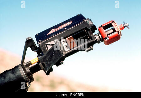 A close-up view of a Multiple Integrated Laser Engagement System (MILES) transmitter, mounted on an M16 rifle, during security police training. Stock Photo