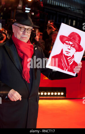 Festival Director Dieter Kosslick with a portrait of himself presented to him by fans at the Award Ceremony red carpet at the 69th Berlinale Internati Stock Photo