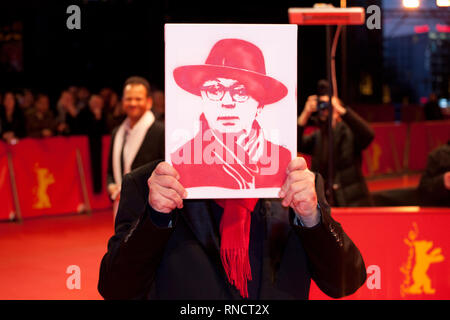 Festival Director Dieter Kosslick holds a portrait of himself presented by cinema fans at the Award Ceremony red carpet at the 69th Berlinale Internat Stock Photo