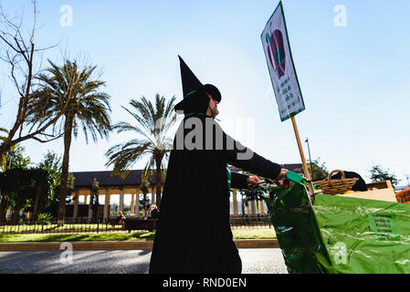 Valencia, Spain - February 16, 2019: People disguised as bad witches during a protest. Stock Photo