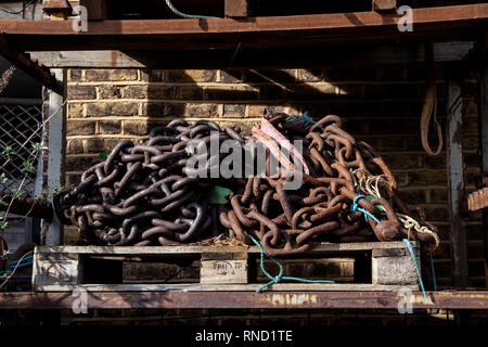 Heavy chains on a metal rack Stock Photo