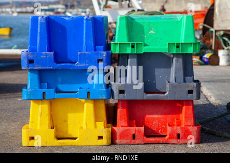 Coloured Plastic Crates on the Dockside Stock Photo