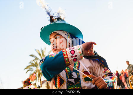 Valencia, Spain - February 16, 2019: Woman performing the Bolivian folk dance the Tinku dressed in folkloric and colorful traditional dress during the Stock Photo