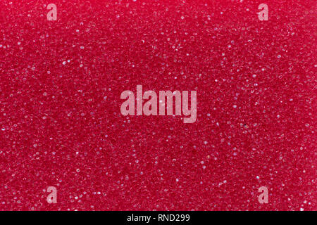 Macro photo of red porous material for background. Stock Photo