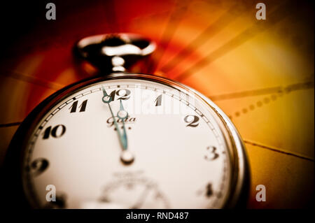 pocket watch indicating two minutes to midnight, concept for doomsday clock Stock Photo