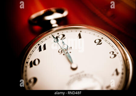 pocket watch indicating two minutes to midnight, concept for doomsday clock Stock Photo