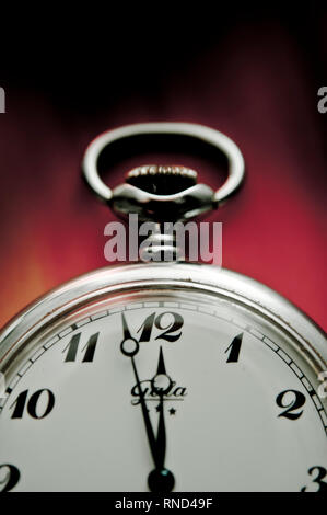 pocket watch indicating two minutes to midnight, concept for doomsday clock Stock Photo