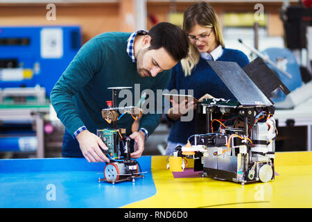 Young students of robotics working on project Stock Photo