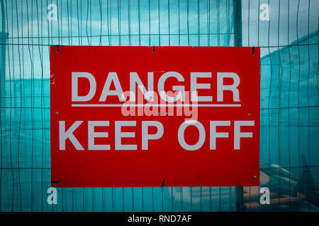 Danger keep off sign on a fence Stock Photo