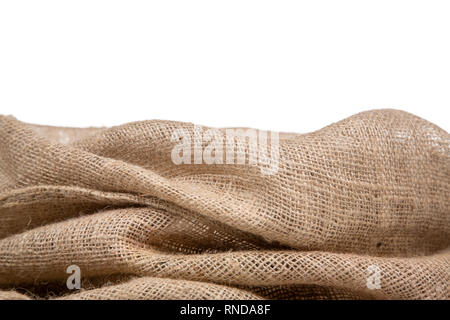 Border of burlap or jute open woven fabric on white background. Stock Photo