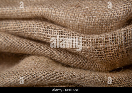 burlap or jute open woven texture background. Shallow DOF Stock Photo
