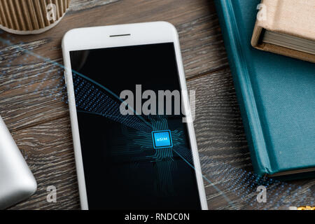 Mobile phone with embedded SIM Stock Photo