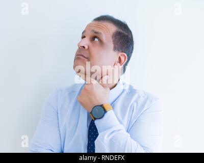 Middle age man thinking clueless about a question Stock Photo