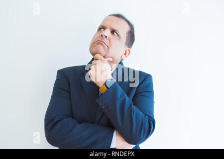Middle age man thinking clueless about a question Stock Photo