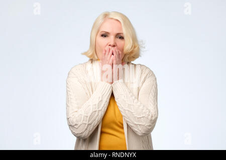 Woman Covering Her Face With Both Hands Isolated On A White Background ...