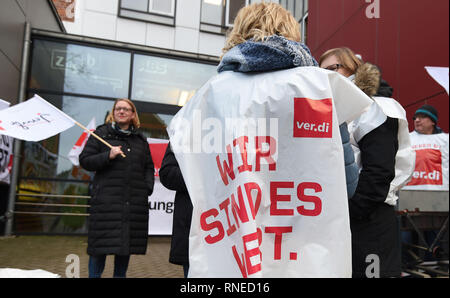 Bremen, Germany. 19th Feb, 2019. Participants of a warning strike stand at the entrance to the 'Allgemeine Berufsbildende Schule' on Steffensweg. The Education and Science Union (GEW) has called for a full-day warning strike at schools in Bremen and Bremerhaven. Credit: Carmen Jaspersen/dpa/Alamy Live News Stock Photo