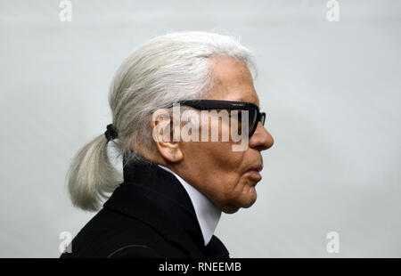 Essen, Germany. 14th Feb, 2014. Fashion designer Karl Lagerfeld goes through an exhibition at the Museum Folkwang. The German fashion designer Karl Lagerfeld has died. Chanel announced this on 19.02.2019 in Lagerfeld's birthplace Hamburg. Credit: Caroline Seidel/dpa/Alamy Live News Stock Photo