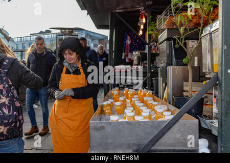London, UK - 20, December 2018: Natural fruit juice stand in Camden Lock Market or Camden Town in London, England, United Kingdom Stock Photo
