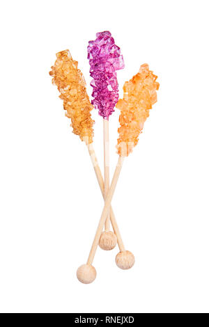 Rock candy or orange and purple sugar candy isolated on white background. Crystallized sugar. Nabat or rock candy is often used as a type of candy, or Stock Photo