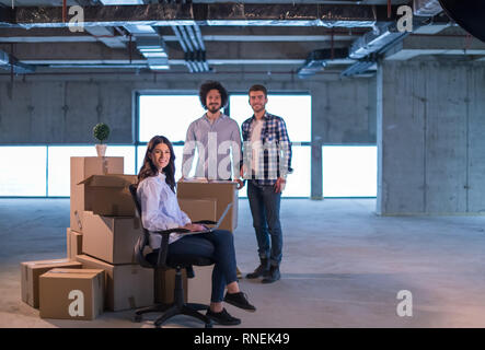 young team of business people in group, architect and engineer on construction site checking documents and business workflow using laptop computer in  Stock Photo