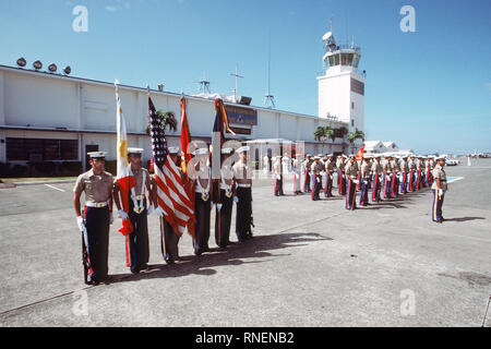 1982 - A Marine Corps honor guard waits to welcome Secretary of Defense Caspar W. Weinberger to Arthur W. Radford Field. Stock Photo