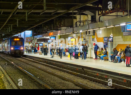 PARIS, FRANCE - NOVEMBER 09, 2018: People at Paris underground metro station. Train arrives. Stock Photo