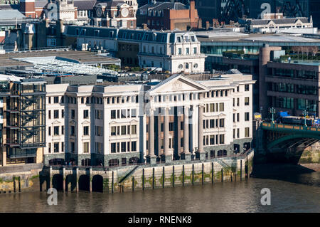 An elevated view of the river frontage of Vintner's Hall & Vintry Place on the north side of Southwark Bridge, London. Stock Photo