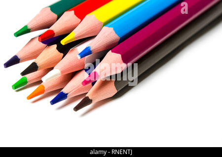 Colourful sharp pencils lie on a white background with copy space top view Stock Photo