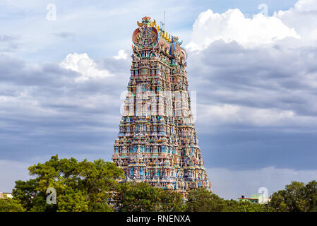 The north gopuram of the Meenakshi temple in Madurai, India. A Gopuram is a monumental gatehouse tower at the entrance of a Hindu temple. Stock Photo