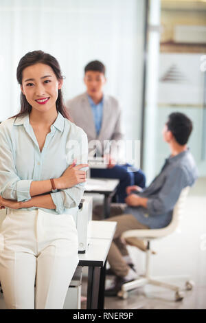 Young men and women in the office Stock Photo