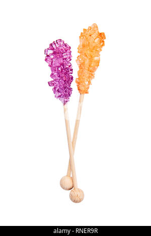 Rock candy or orange and purple sugar candy isolated on white background. Crystallized sugar. Nabat or rock candy is often used as a type of candy, or Stock Photo