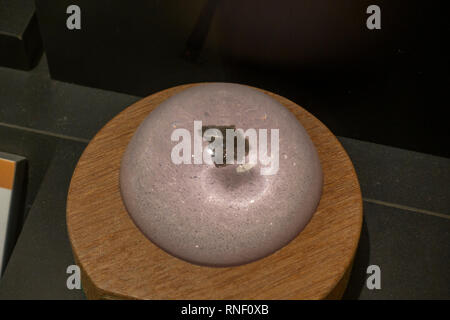 A trinitite paperweight, soil fused into a glass-like substance by the Trinity Test, Nevada, United States. Stock Photo