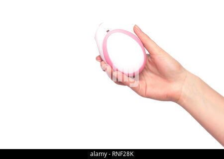 The girl holds in her hand on a white background a fetal doppler to listen to the baby's heartbeat, close-up, isolate Stock Photo