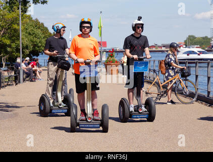 Copenhagen, Denmark - June 27, 2018:  A small group of people are using Segway two-wheeled self-balancing personal transporters near the Little Mermai Stock Photo